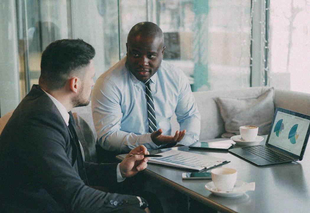A clean modern workspace with a laptop preparing client deliverables