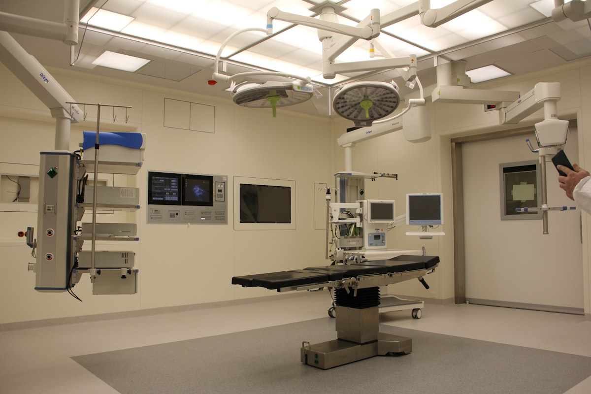 Empty operating room with monitors and medical equipment